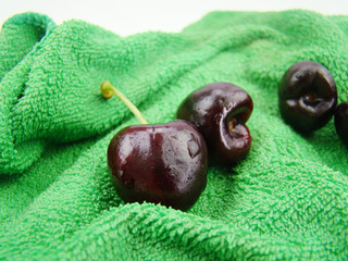 Bunch of fresh cherries on green cloth