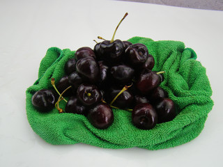 Bunch of fresh cherries on green cloth