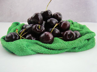 Bunch of fresh cherries on green cloth