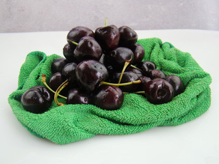 Bunch of fresh cherries on green cloth