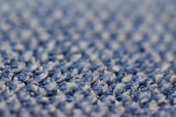 Fototapeta premium Defocused macro abstract texture background of a vintage worn blue color cloth towel