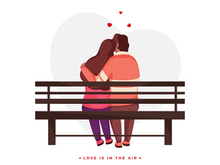 Back View of Loving Couple Hugging Sit on Bench for Love is in the air concept.