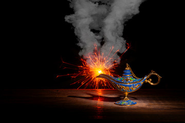 Vintage lamp of Aladdin on black background