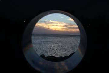Sunset of ocean framed in a circle