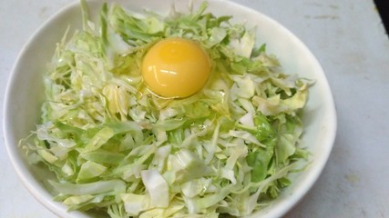 Egg on some chopped cabbage