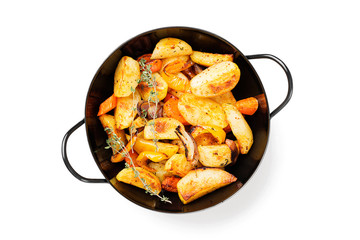 Roasted potato wedges with vegetables and herbs. isolated on white background