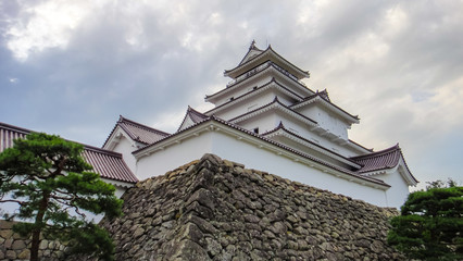 Fototapeta premium Aizu-Wakamatsu Castle, aka Tsuruga Castle. A concrete replica of a traditional Japanese castle, at the center of the city of Aizuwakamatsu, in Fukushima Prefecture, Japan