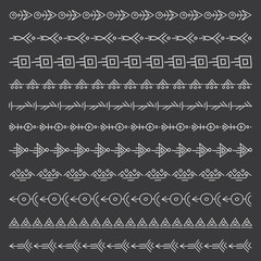 Obraz premium Set of freehand brushes in tribal style. Vector illustration. Decorative ethnic border. Linear boho elements.