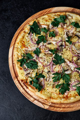 Pizza with champignons on black