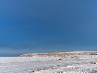 view of the steppe on a clear Sunny winter day