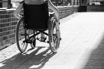 Fototapeta premium woman on wheelchair entering the platform