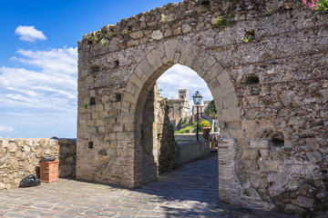 Historica gate in Savoca, small town on Sicily in Italy, view with Saint Nicholas Church also called Saint Lucy Church