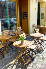 Fototapeta na wymiar european restaurant - tables and chairs on the street
