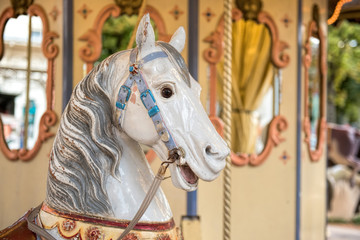 Fototapeta na wymiar white wooden horse from carousel