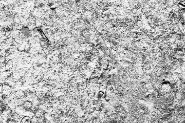 Texture of a concrete wall with cracks and scratches which can be used as a background