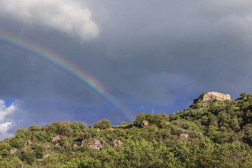Rainbow over hill with castle ruins of Castiglione di Sicilia town on Sicily Island in Italy