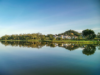 Fototapeta na wymiar Darulaman Lake in Jitra, Kedah, Malaysia is a perfect place to enjoy a cool evening just paddling in the lake or riding the buggies around. It is a very good place for boating and relaxation. 