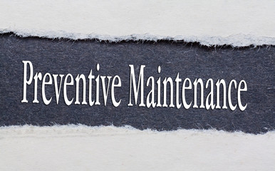Preventive Maintenance words under torn black paper.