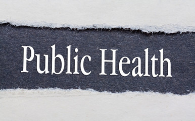 Public health words under torn black paper.