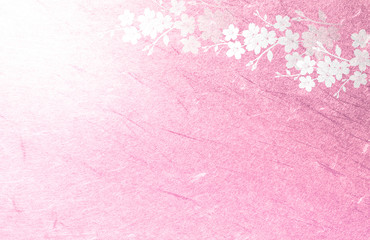 ピンクの和紙を背景にした桜