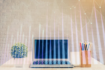 Double exposure of forex chart and work space with computer. Concept of international online trading.