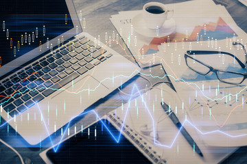 Financial graph colorful drawing and table with computer on background. Double exposure. Concept of...