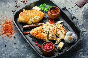 Grilled chicken fillets on slate