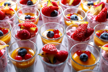 Dessert of yogurt and berries in glass stacks