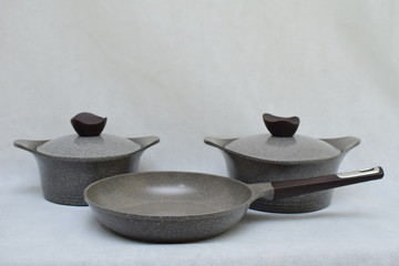 Mock up / design set of elegant and traditional cooking pots and goblet , grey and black made of ceramic isolated on white background 