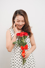 Is it for me. Waist up portrait of joyful young lady receiving red rose