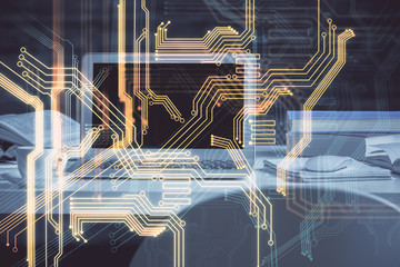 Computer on desktop in office with technology theme hologram. Multi exposure. Tech concept.