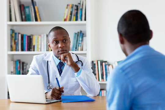 African american doctor with male patient