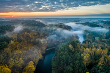 Foggy river at sunrise, view from above