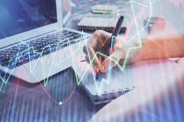 Forex chart displayed on woman's hand taking notes background. Concept of research. Multi exposure