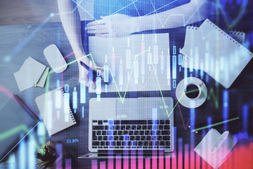 Financial graph displayed on woman's hand taking notes background. Concept of research. Multi exposure