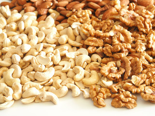 Walnuts, almonds and cashews as a background, texture and pattern. Health nuts