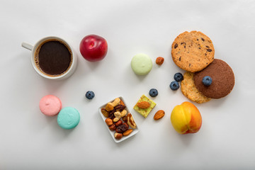 Sweets, fruits and berries on white background for coffee