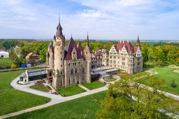 Fabulous historic castle in Moszna near Opole, Silesia, Poland. Built in XVII century, extended from 1900 to 1914. One of the best known and most beautiful monuments in Upper Silesia. Aerial view - 314642374