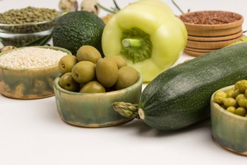 Healthy food for diet and lifestyle: green vegetables, quinoa bulgur, chickpeas, flax almond. Alkaline foods set.