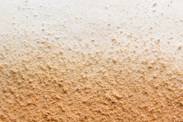 Face powder background. Light brown makeup foundation powder texture