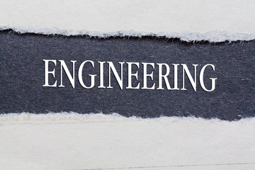 Rip Blue Paper and white background with engineering word  written on