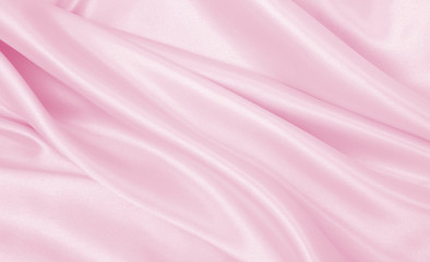 Smooth elegant pink silk or satin texture as wedding background. Luxurious background design