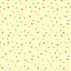 Easter yellow seamless pattern with little eggs and colorful sprinkles isolated on black background.