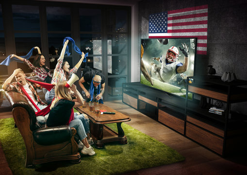 Group of friends watching TV, american football match, championship. Emotional men and women cheering for favourite team, look on fighting for ball. Concept of friendship, sport, competition, emotions