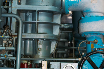 Pipes equipment and machine tools and wire valves in the production room at the refinery petrochemical chemical industrial plant. The background. Texture