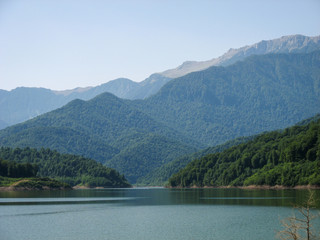 Lake surrounded by mountains and forest in summer day. The forests of northern Iran near the Dorfak mountain in Guilan province.