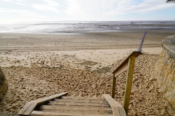 wooden stairs sand beach access to bassin d'Arcachon in southwest France city of Andernos les bains