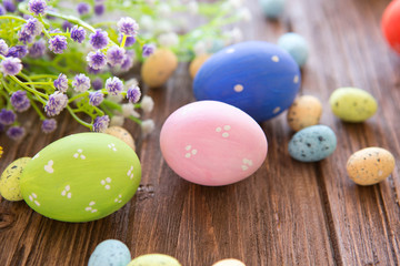 Obraz na płótnie Canvas Easter eggs in pastel color on old brown wooden table