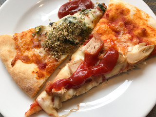 Piece of pizza with tomato