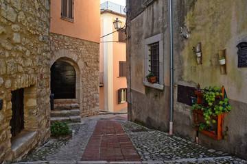 Obraz na płótnie Canvas Veroli, Italy, 01/03/2020. A narrow street between the old houses of a medieval village